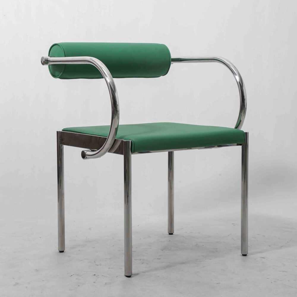 Italian PU leather dining and lounge chair with polished stainless steel tubular frame.
