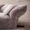 Elegant and spacious modern minimalist living room featuring a plush chenille petal sofa with customizable lumbar support.