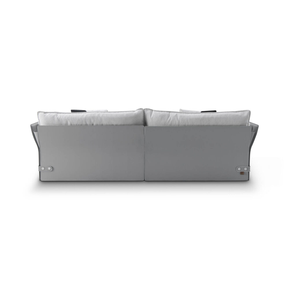 Back view of a three-seater sofa, showcasing its spacious cushions and elegant design details.