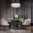 Elegant round green marble table set for fine dining in a modern luxury hotel restaurant interior