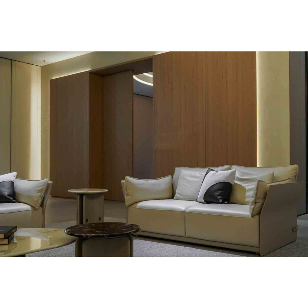 Modern spacious lounge area with elegant sectional sofa and warm lighting