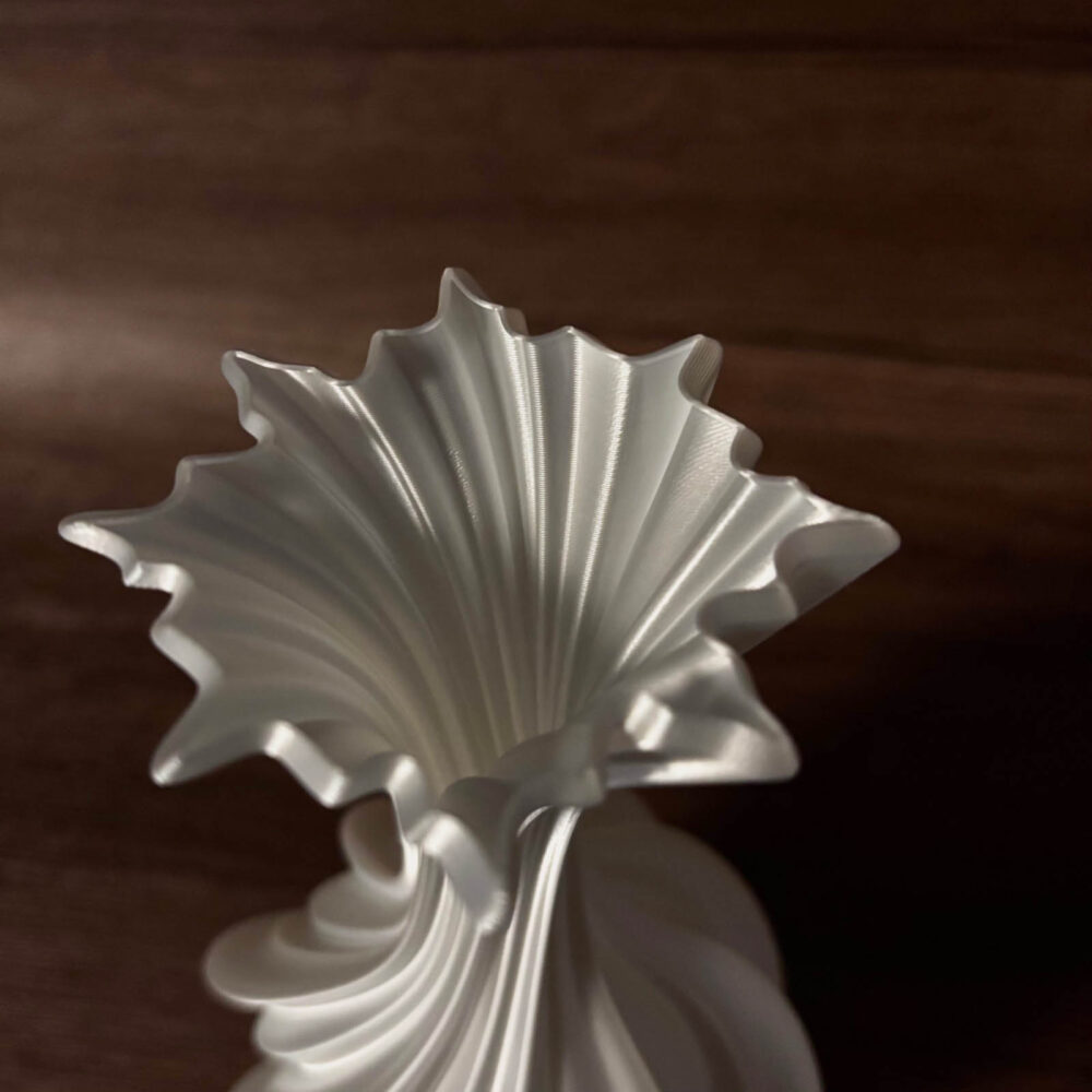 Pearlescent white resin vase with curved silhouette for living room decor