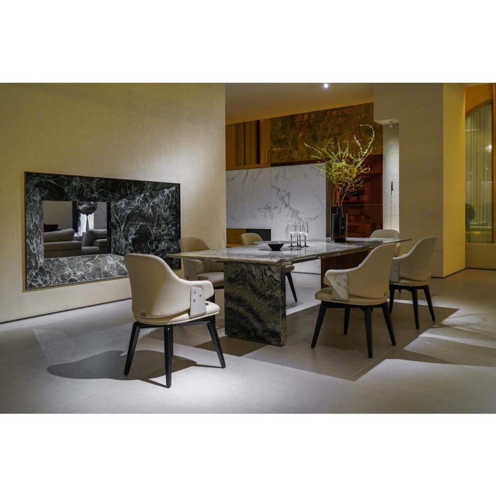 Elegant furniture showroom display with Italian leather dining chairs and wood table