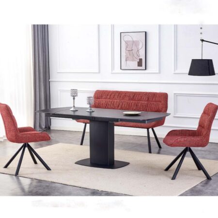 Modern red fabric dining set with chairs, bench, and black rectangular table in contemporary restaurant interior.
